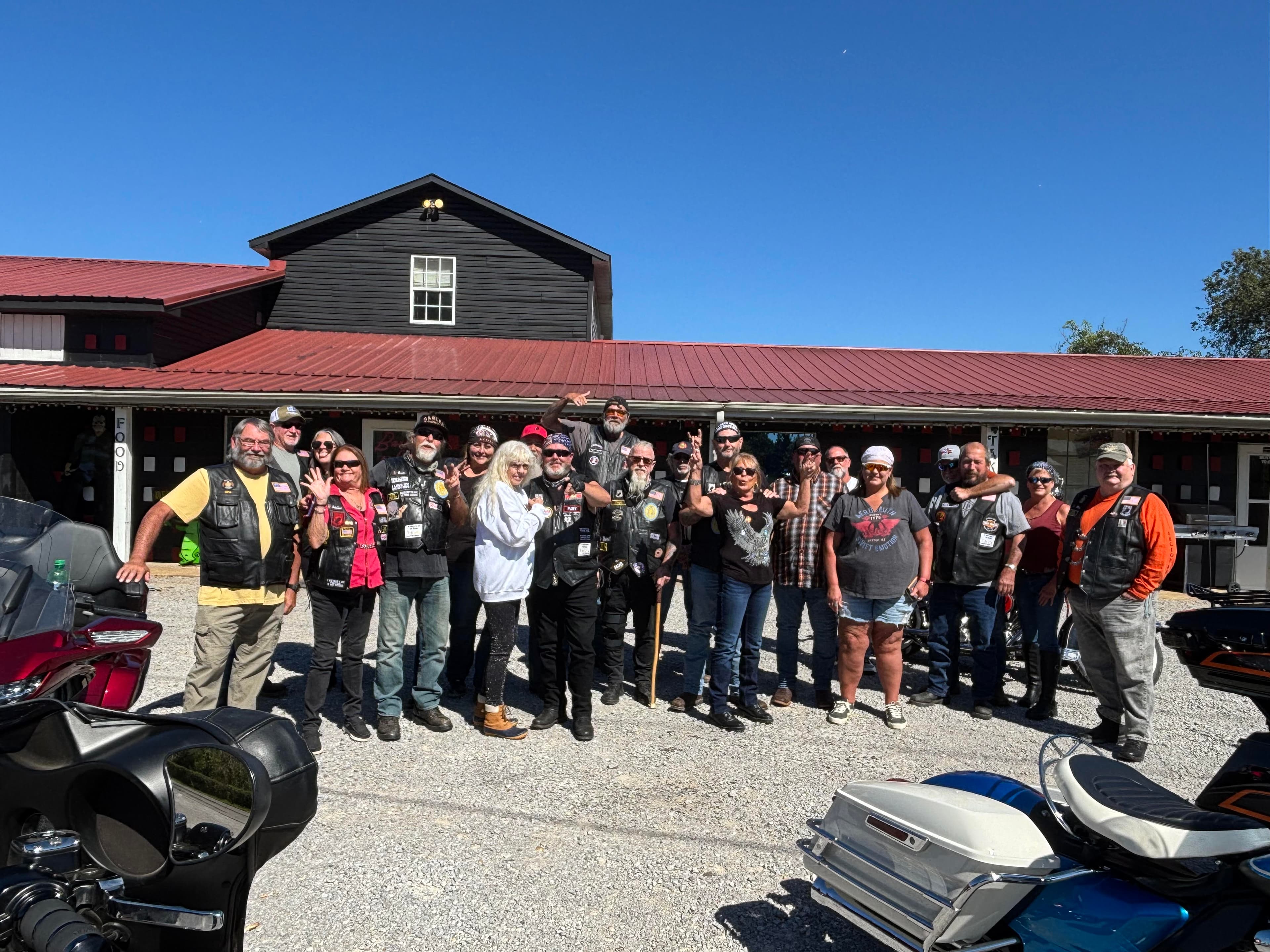 American Legion riders gathered in front of Barb's Place with bikes
